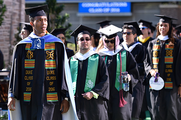 Students walk into commencement