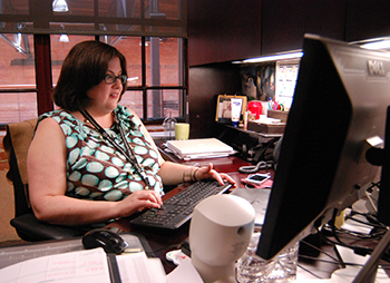 Lisa Frazier stays busy during the summer by making sure departmental spending is in line with budgets. Photo by Bryan Roth.