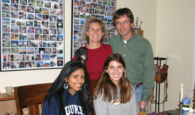 First-year students Malika Atmakuri and Kelly Schiabor share a dinner with their hosts Diane Daniel and Wessel Kok. 