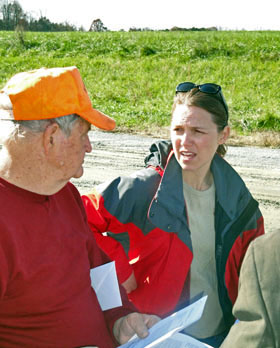 Hog farmer Loyd Bryant confers with Duke's Tatjana Vujic during a November 2009 site visit. 