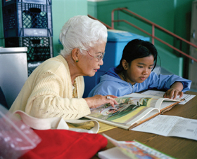 Alex Harris photograph shows an Experience Corps mentor and student in San Francisco 