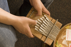 Les Todd, Duke Photography Music professor Paul Berliner plays the mbira, one of Africa's most popular instruments, for his students.