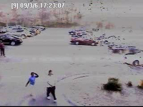 Two of the suspects caught on video walking from the parking lot. 