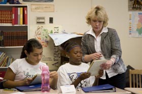 Jan Riggsbee works with Durham Public School students Casey Barr and Joy Wright. 