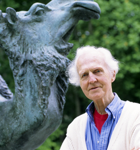 In this 1998 photo, Schmidt-Nielsen stands on the Duke campus next to a bronze statue commissioned in his honor 