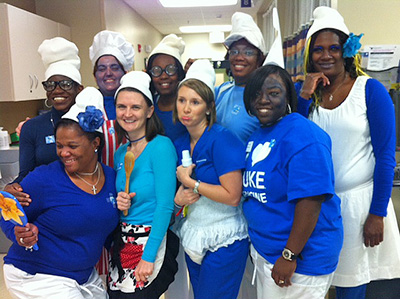 Nine staff members from Duke Gastroenterology of Raleigh came to work on Halloween as The Smurfs. Back row, from left, are Ponda Hatton, Kelly Osborne, Gwendolyn Thompson, LaJuanna O'Neal and Angela Canady-Blaylock. Front row, from left, Tracy Tillery, Crystal Munck, Naomi Clifton and Tanikka Long.