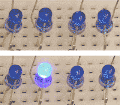 Duke researchers demonstrated their new “spray-on” digital memory by programing a simple circuit to display four LED lights in different patterns.