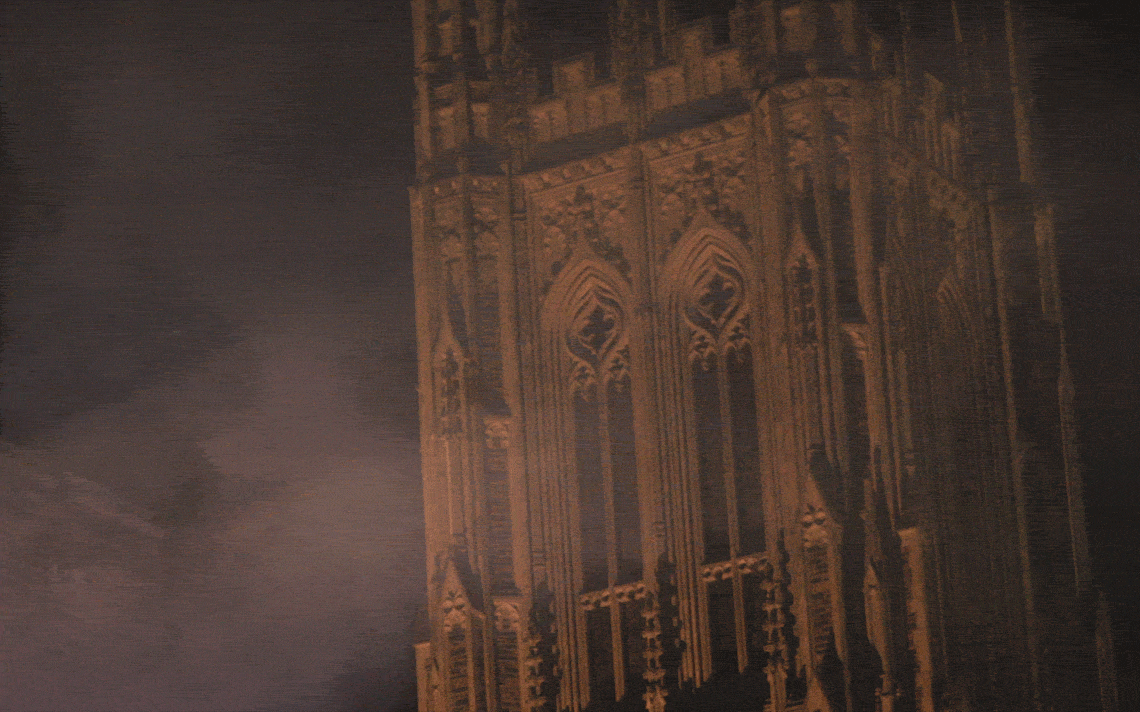 spooky fog passes across Duke Chapel at night