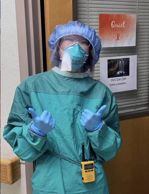 Emily Jamieson wears scrubs, gloves, mask and face shield in Duke University Hospital's oncology unit. Photo courtesy of Emily Jamieson.