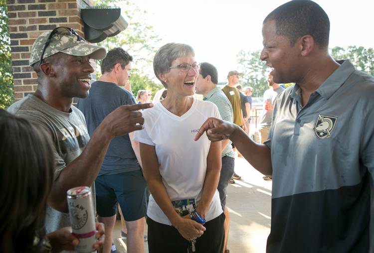 Sue Wasiolek, associate vice president for student affairs, talks with Duke and West Point alumni.