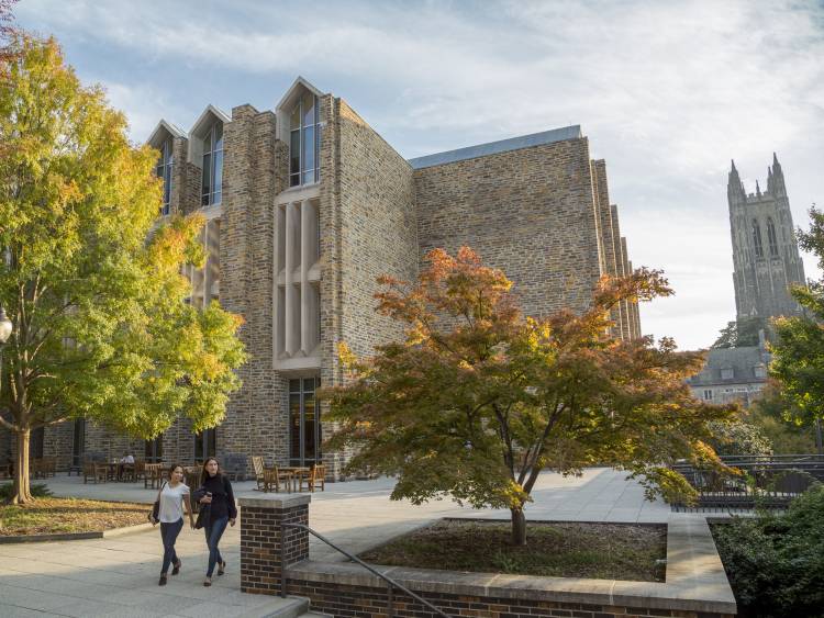 Students walk to and from class on a crisp, Fall day outside Perkins Library, beside Duke Chapel, on West Campus.