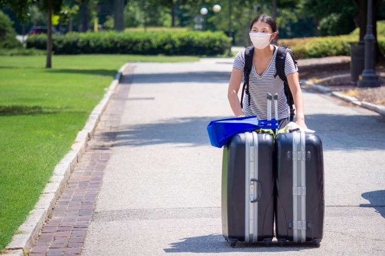 Students moving in their belongings on East Campus on the first day of move-in for the class of 2024.