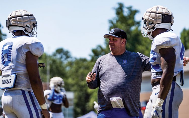 Mike Elko instructs a pair of players as the Duke football team prepares for the 2022 season. Photo courtesy of Duke Athletics.