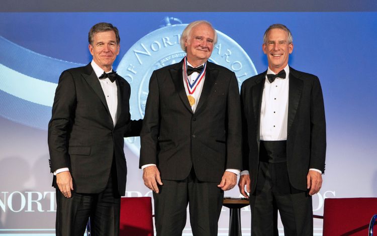 Blake Wilson receives the North Carolina Award alongside Governor Roy Cooper, left, and Secretary of the North Carolina Department of Natural and Cultural Resources Reid Wilson, right. Photo courtesy of Blake Wilson.