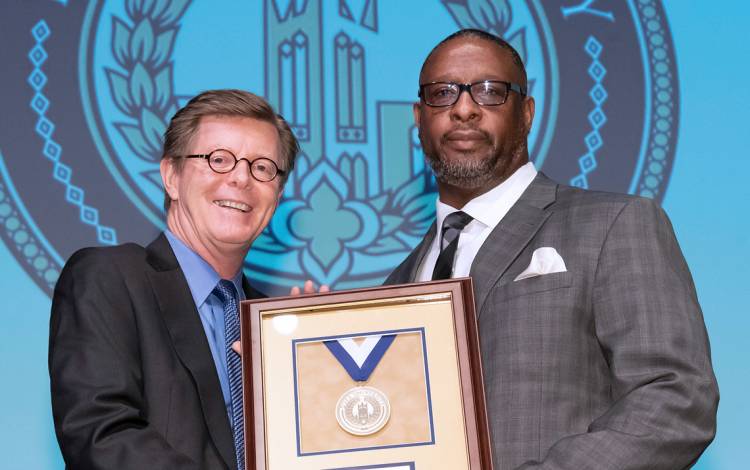 Duke University President Vincent E. Price and Presidential Award winner Larry Gill. Photo by Les Todd.