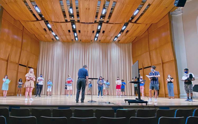 Rodney Wynkoop leads the Duke Chorale through a rehearsal in Baldwin Auditorium. Photo courtesy of Duke University Music Department.
