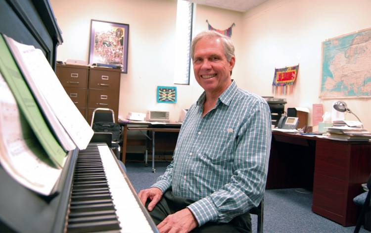 Tom Brothers sits in his office in the Biddle Music Building. The office used to belong to ground-breaking jazz talent Mary Lou Williams. Photo by Stephen Schramm.