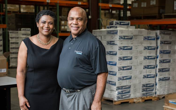 Tim Catlett, right, and his wife Sonya, left, stand in their Progressive Business Solutions warehouse. 