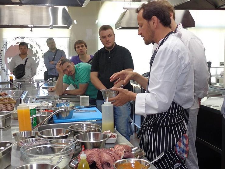 Eduardo Polit, right, teaches a group of aspiring chefs how to prepare ceviche at a Masterclass in St. Petersburg, Russia. Photo courtesy of Eduardo Polit.