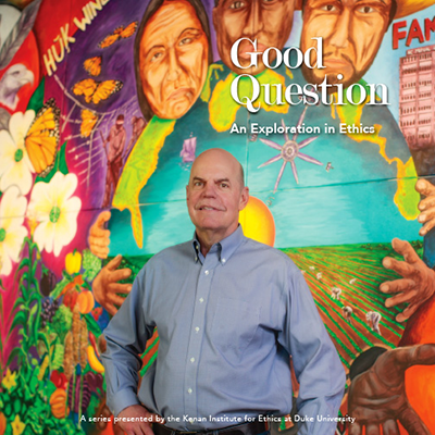 Charlie Thompson in front of the mural his class on farmworkers produced with artist Cornelio Campos. (Photo: Kenan Institute for Ethics)