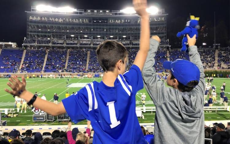 olin Jee, left, and Kevin Jee cheer on Duke at a game in 2018. The brothers have been big Duke football fans their entire lives. Photo courtesy of Lori Jee.