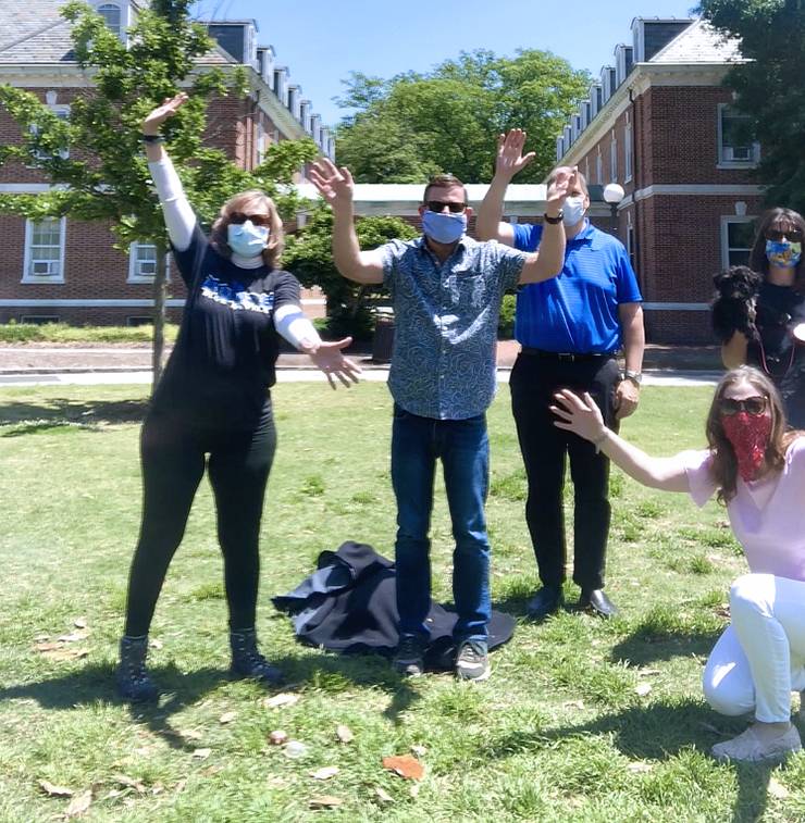 Cherie Michaud, crouching on the far right, takes a walk with some Duke Alumni Affairs colleagues on East Campus in September of 2020. Photo courtesy of Cherie Michaud.