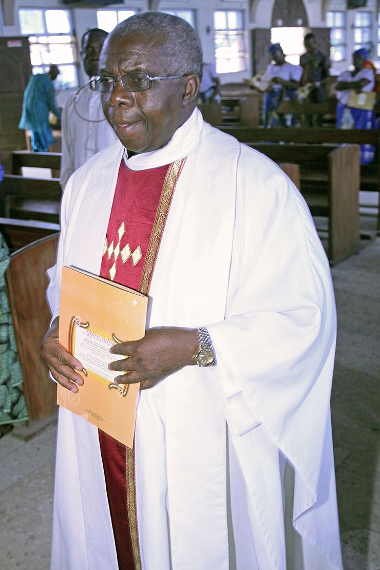 Omoviekovwa Nakireru prepares to lead Catholic mass back home in Nigeria. Photo courtesy of Earlier in his career, Omoviekovwa Nakireru stops to take a photo while wearing his white coat. Photo courtesy of Omoviekovwa Nakireru.