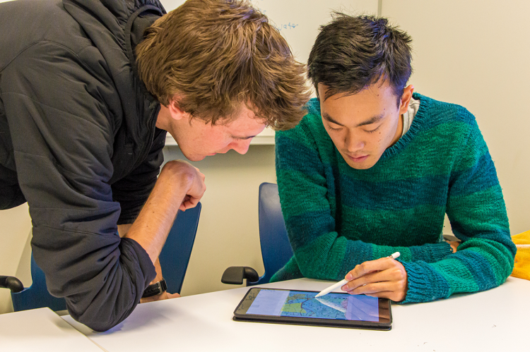 Walker Grimshaw (left) and Shawn Li refine the service boundaries for one local drinking water system in North Carolina. Students worked in pairs during the mapping process to learn from each other and provide added accountability.