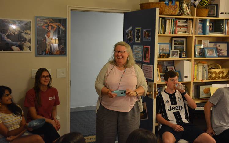 Catherine Admay, standing, hosts a Pictionary night at her apartment in Bassett Residence Hall.