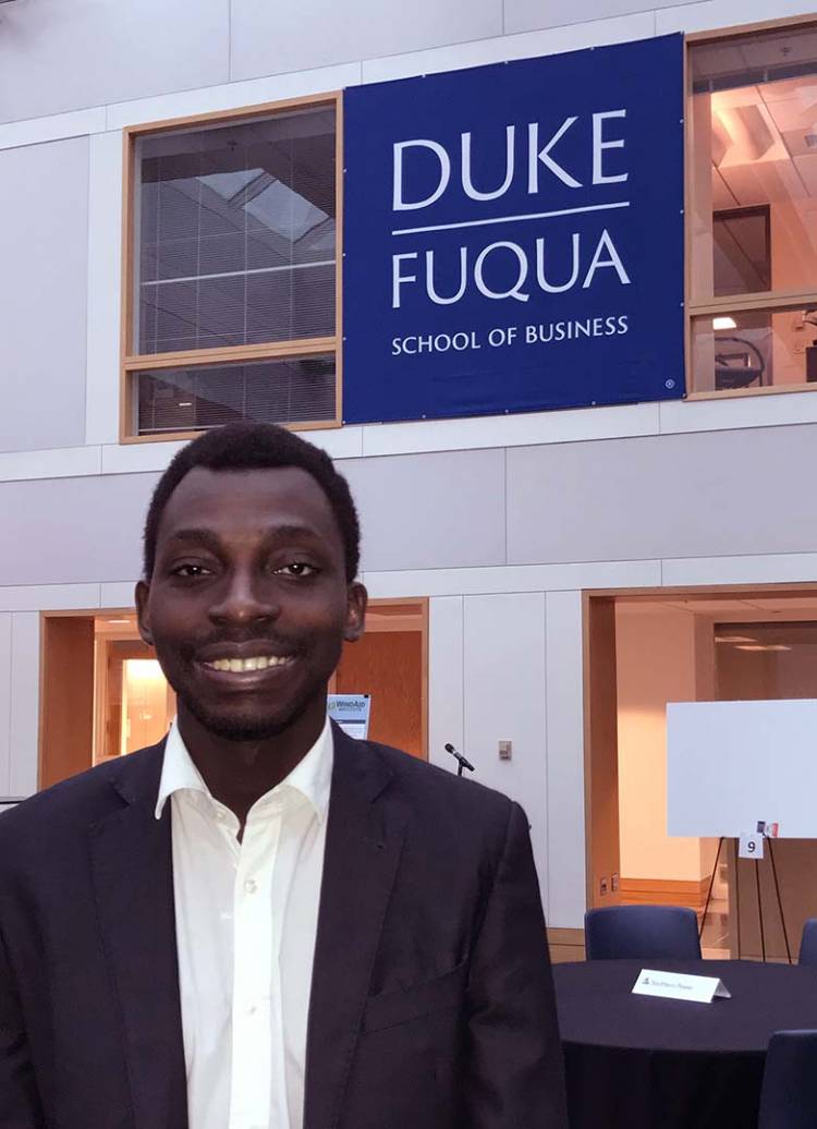 Jean Dominique Vidjanagni, the first student from Cote D’Ivoire to attend Duke, poses for a photo in the Fuqua School of Business.
