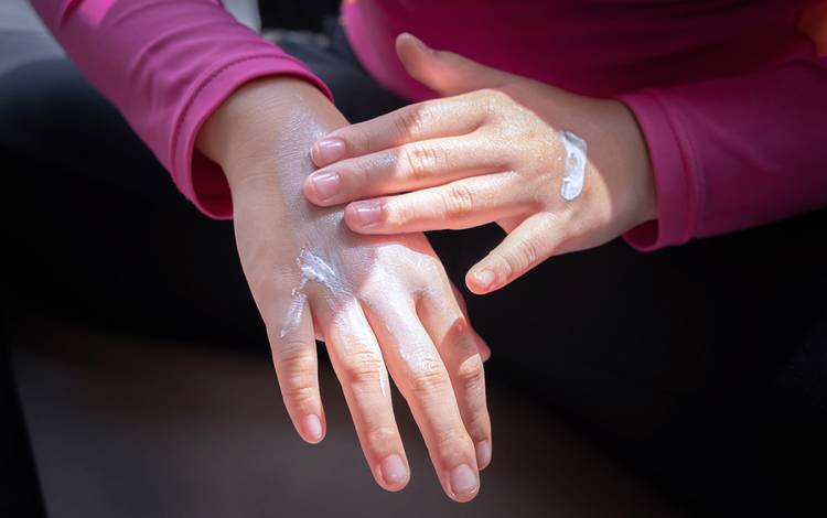 Applying sunscreen to your face and hands each day can help prevent sun damage.