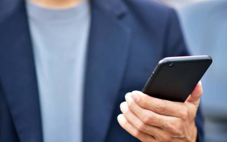 A person holding a cell phone.