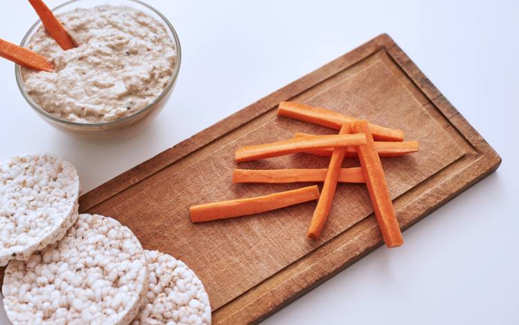 Replace snacking on chips with a healthy alternative like carrots and hummus.