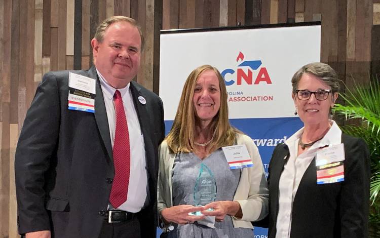 Flanked by officials from the North Carolina Nurses Association, Duke's Julia Gamble, center, was honored for her work last year. Photo courtesy of the North Carolina Nurses Association.