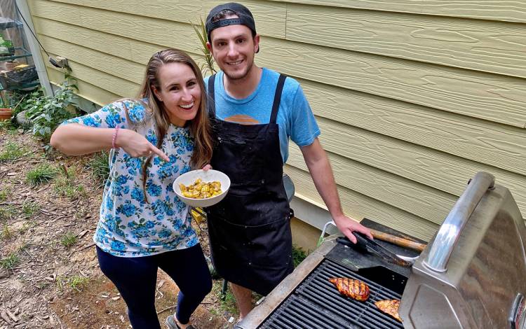 Katie Ryan and her fiance Michael Ryder, enjoy chicken and vegetables they prepared on the grill. Photo courtesy of Katie Ryan.