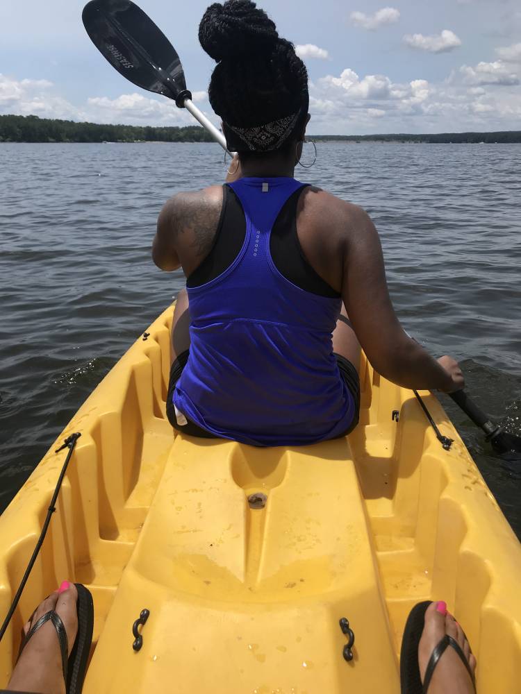 Kyara Watkins, a certified medical assistant for Duke Primary Care Hillsborough, kayaks at Jordan Lake in 2019. Photo courtesy of Kyara Watkins.