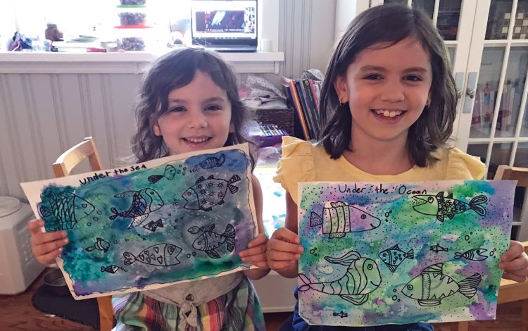 Jessica Sperling's children, Liddy, left, and Eve, right, show off their art. Photo courtesy of Dr. Jessica Sperling.