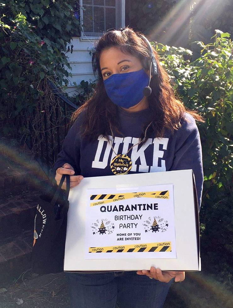 Lupita Temiquel McMillan holds a birthday present.