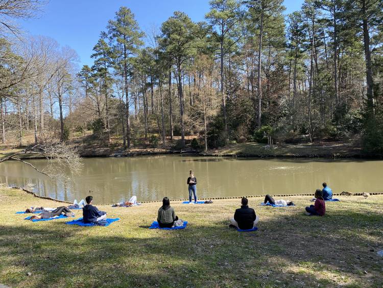 Duke Kunshan students hold a meditation session in Duke Gardens. 