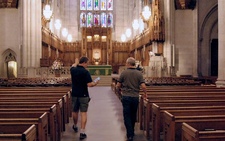 Technical Services Manager Selden Smith and Duke University Chapel Communications Manager James Todd check audio readings.