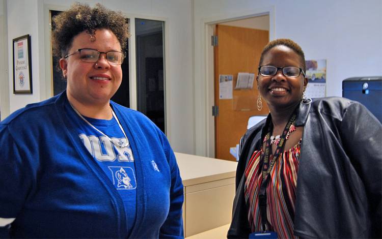 As part of the Foundational Skills Program, Marquita Mangum, right, is shadowing Duke Disability System's Ashley Robbins. Photo by Stephen Schramm.
