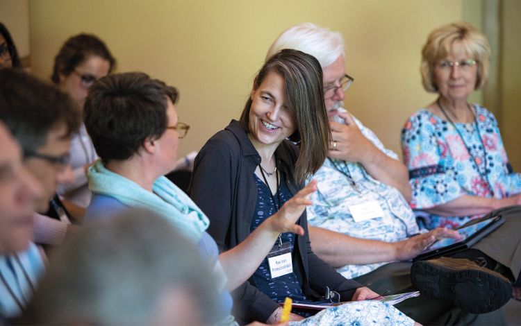 Rae Jean Proeschold-Bell talks with attendees at an event on clergy health. Photo courtesy of Duke Global Health Institute.