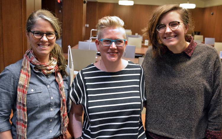 Left to right: Megan O’Connell, Kelly Wooten and Hope Ketcham Geeting assist patrons in the Rubenstein reading room. Photo by Jonathan Black.