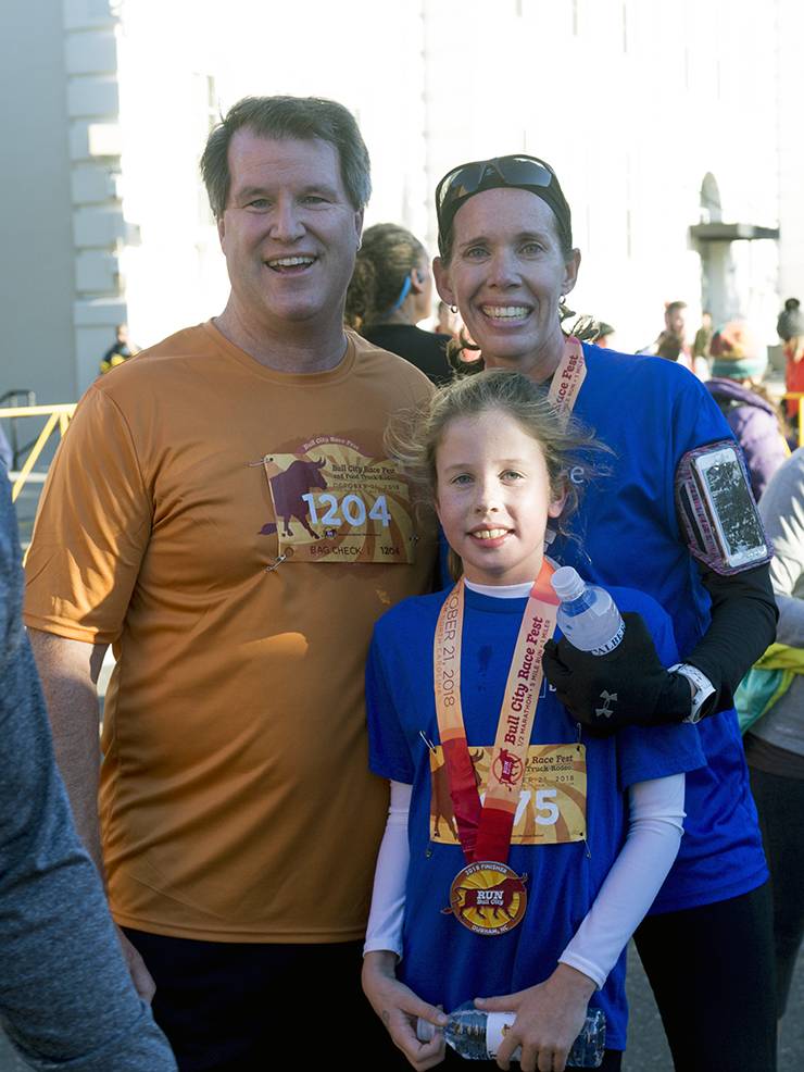 Erik Hauck, Kara Lyven and her daughter, Maia, completed Bull City Race Fest’s 5-mile run in October. Photo courtesy of Kara Lyven. 