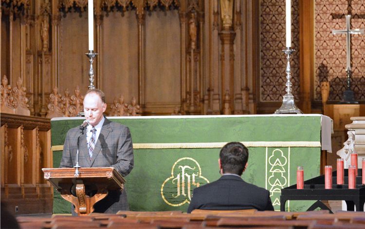 Duke chaplain Artie Hendricks stands in front of Duke University Chapel during the 2021 employee memorial service. Photo by Stephen Schramm.