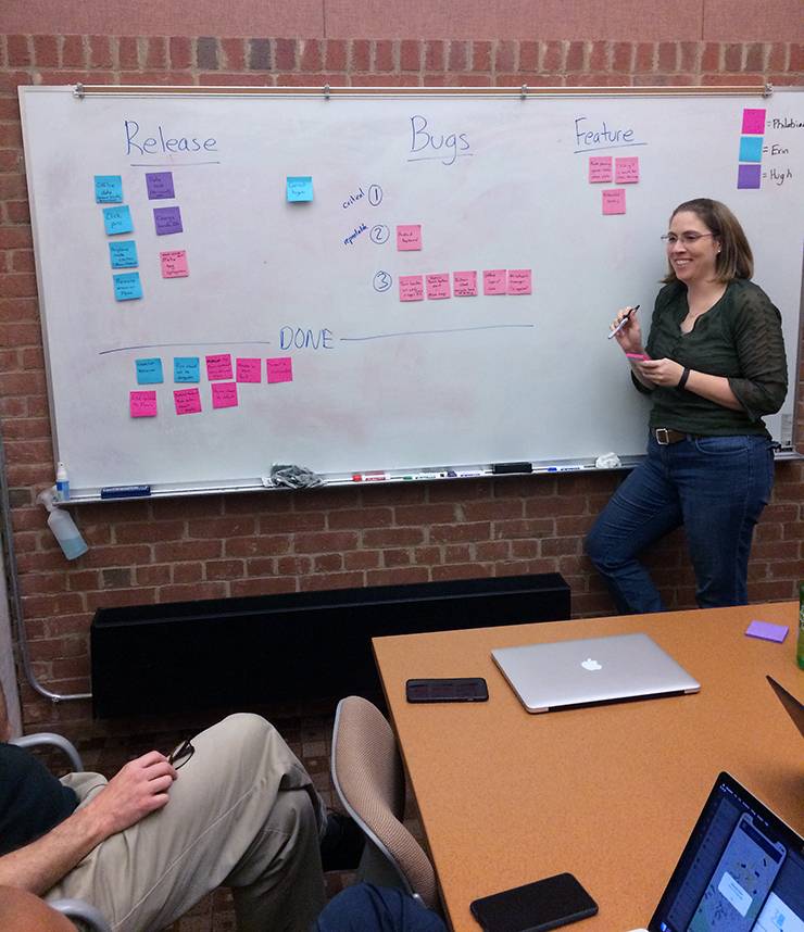 Laura Webb works through a project plan with her team using sticky notes. Photo courtesy of Laura Webb.