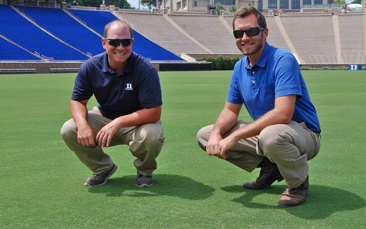 Ian Christie, left, and Scott Thompson, right, are among those responsible for keeping Duke's athletic fields in good shape.