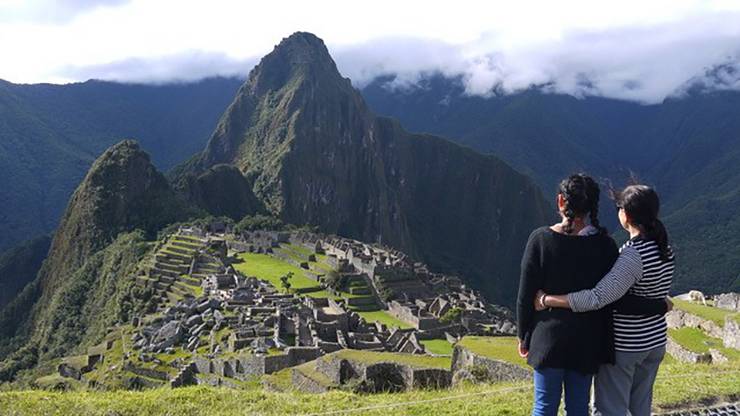 Karishma Simmons, left, and Veronica Simmons, right, stand arm-in-arm at Machu Picchu. Veronica Simmons, right, stands with her daughter, Karishma Simmons, at Machu Picchu.