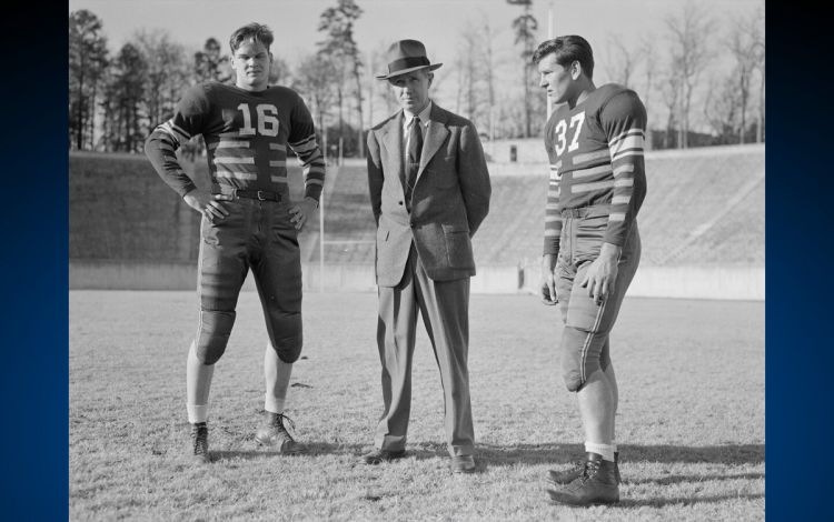 Hired in 1931, Wallace Wade, center, proved to be a transformative coach for Duke Football. Photo courtesy of Duke University Archives. Hired in 1931, Wallace Wade, center, proved to be a transformative coach for Duke Football. Photo courtesy of Duke University Archives.