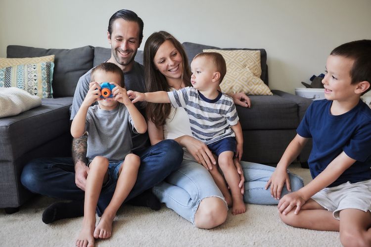Zach Smith and his wife Honor cover their health care needs, and those of their children, from left to right, Thomas, Fritz, and David, with Duke’s employee medical benefits.